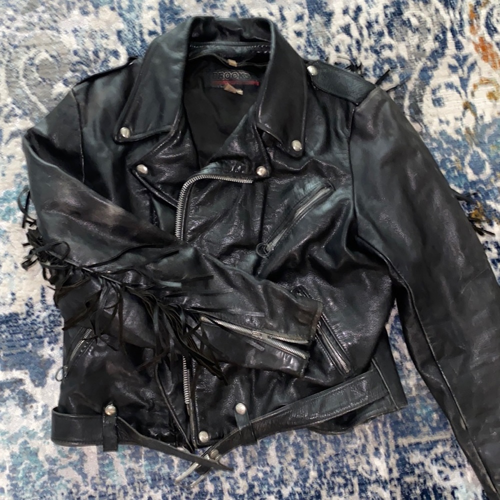 Vintage leather jacket with fringe detail.